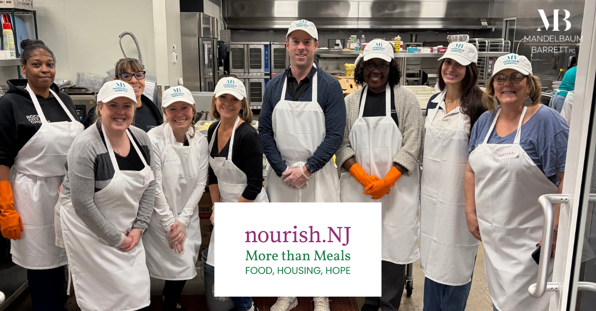 Mandelbaum Barrett PC team volunteering at nourish.NJ food service event in commercial kitchen.